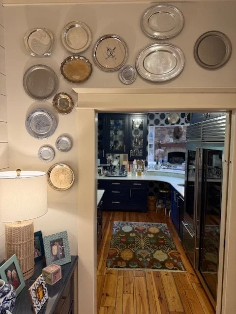 Wall+of+plates+into+kitchen Wall of antique plates